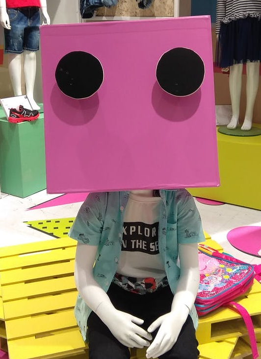 mannequin wearing pink box